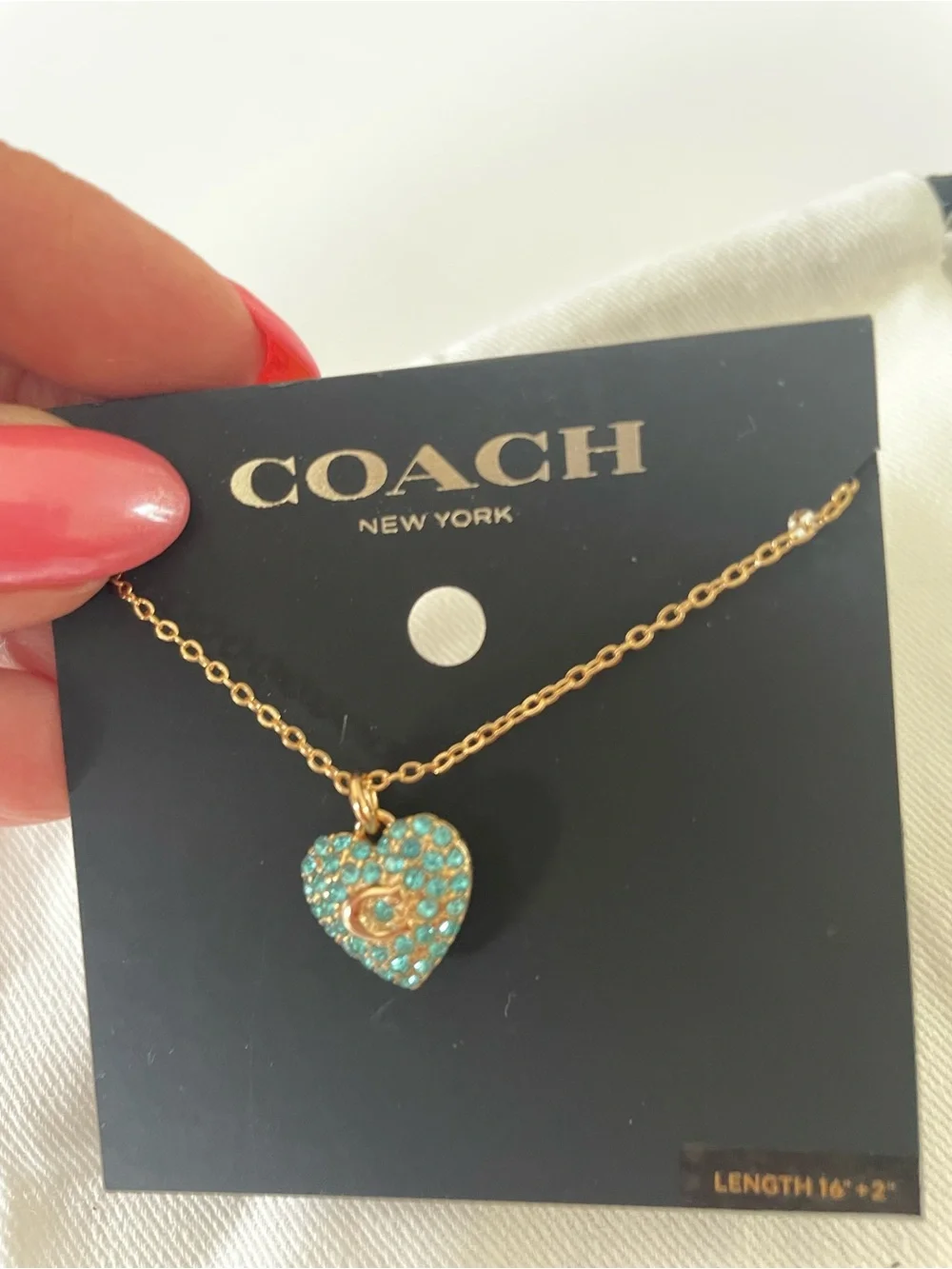 Coach Gold-Tone Heart Pendant Necklace with blue Crystals